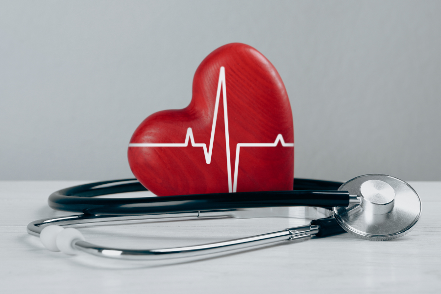 Heart-shaped symbol and stethoscope representing medical care