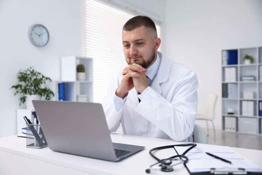 Medical doctor discussing patient care via video call